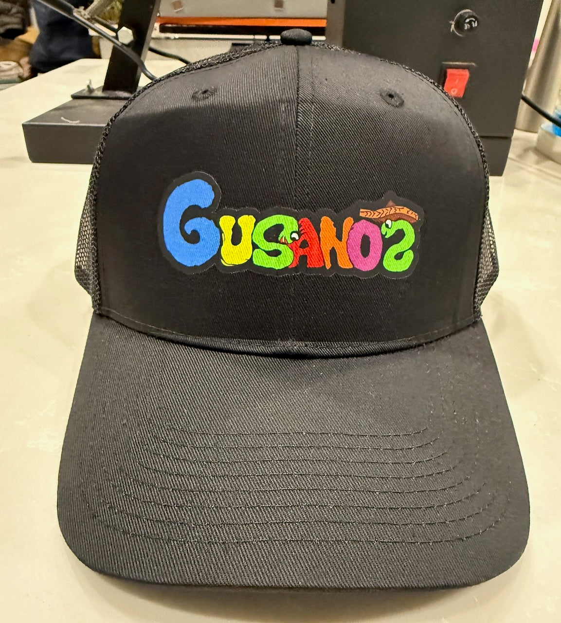 Black on Back Trucker Hat Gusanoz